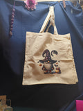Canvas tote bag with Halloween gnome holding pumpkin string lights